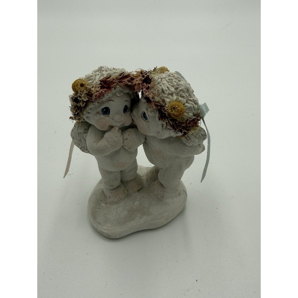 Dreamsicles "Stolen Kiss" cherub figurines from 1994, created by artist Kristin